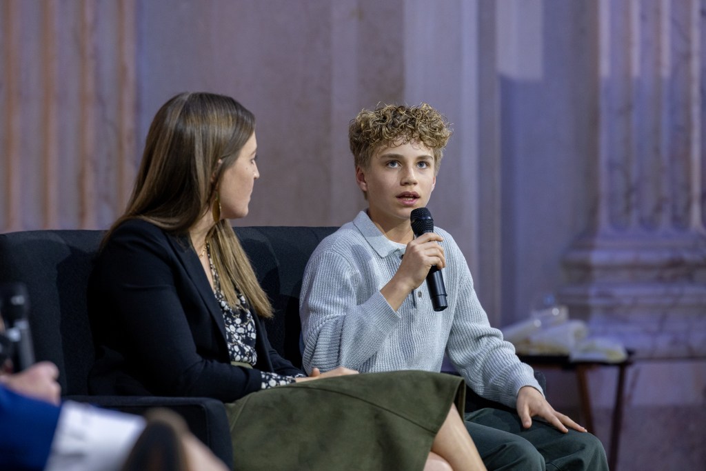 Teen speaking into the microphone about his CAR T-cell therapy experience.